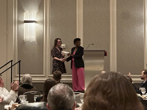 Sarah Clark receiving an award
